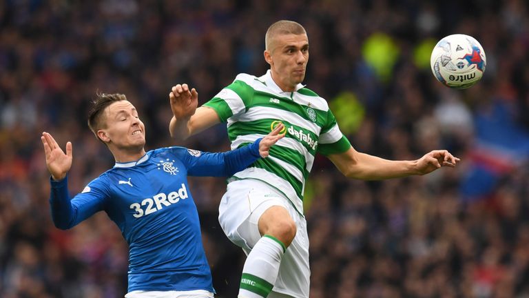Barrie McKay (left) and Jozo Simunovic (right) go for the ball at Hampden Park