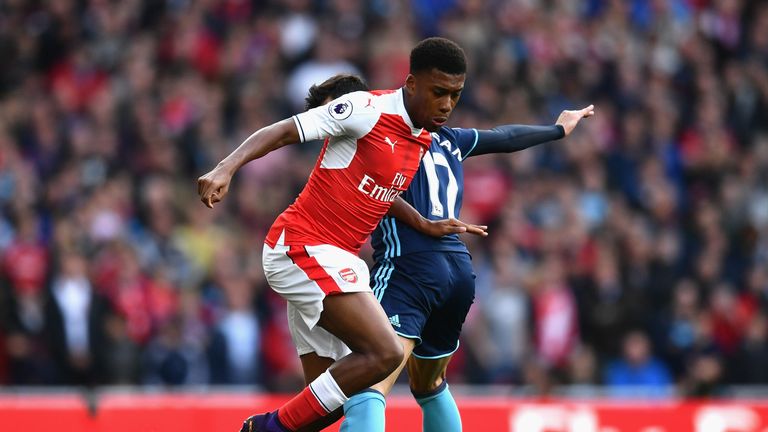 Alex Iwobi battles for the ball in the first half