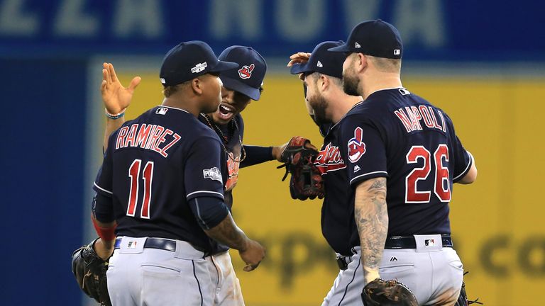 Jose Ramirez #11, Francisco Lindor, Jason Kipnis and Mike Napoli #26 celebrate as Cleveland Indians reach World Series