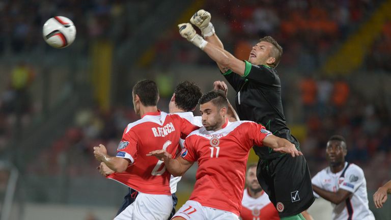 Malta goalkeeper Andrew Hogg (R) says Manchester City