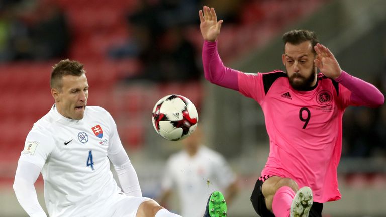 Jan Durica knocks the ball away from Steven Fletcher