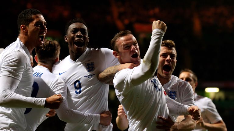 Wayne Rooney celebrates scoring England's second goal against Scotland in November 2014