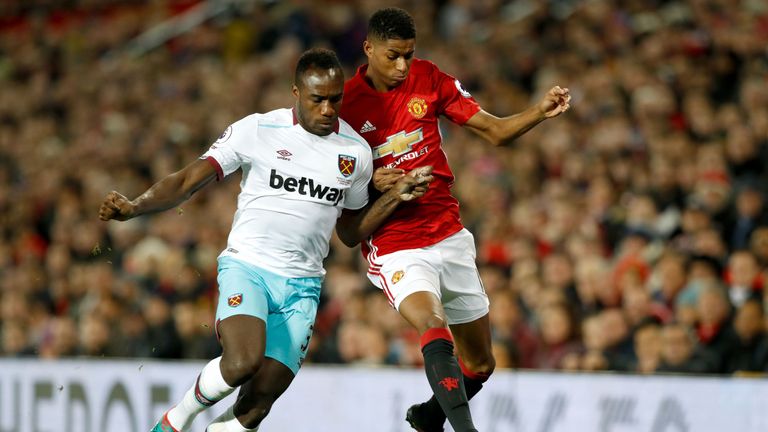 Antonio and Marcus Rashford tangle during the 1-1 draw at Old Trafford