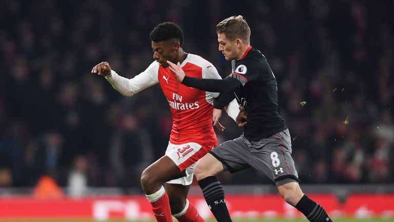 Jeff Reine-Adelaide of Arsenal holds off Southampton's Steven Davis 