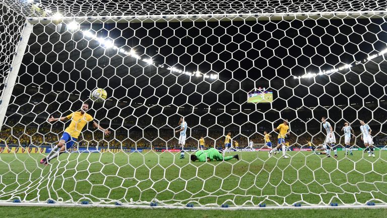 Coutinho celebrates the opener to send Brazil on their way against Argentina