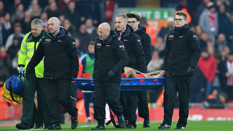Coutinho is carried off after being injured in the first half of Saturday's 2-0 win over Sunderland