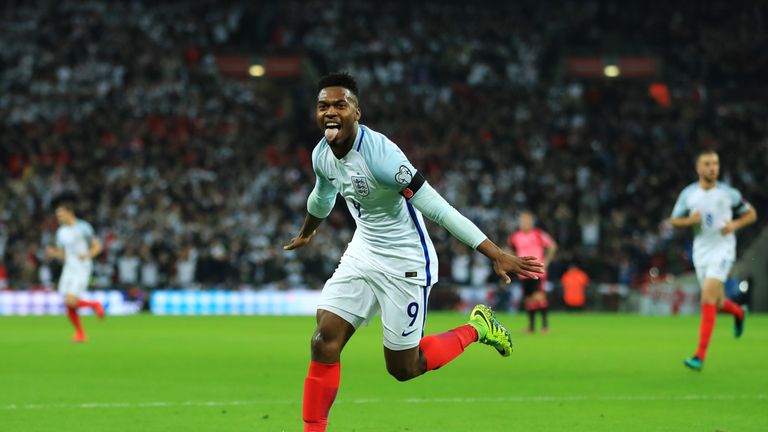 Daniel Sturridge wheels away in celebration after putting England ahead