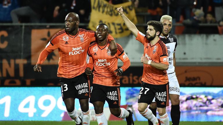 Abdul Waris (C) celebrates after scoring for Lorient
