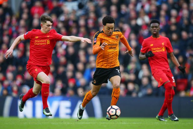 Helder Costa of Wolves takes on Ben Woodburn of Liverpool