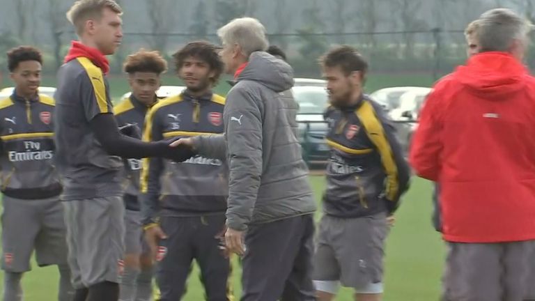 Wenger greets his players on Friday morning