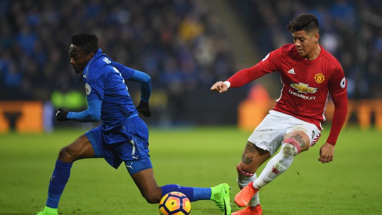 Marcos Rojo (right) and Ahmed Musa tussle at the King Power