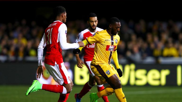 Roarie Deacon is put under pressure by Jeff Reine-Adelaide