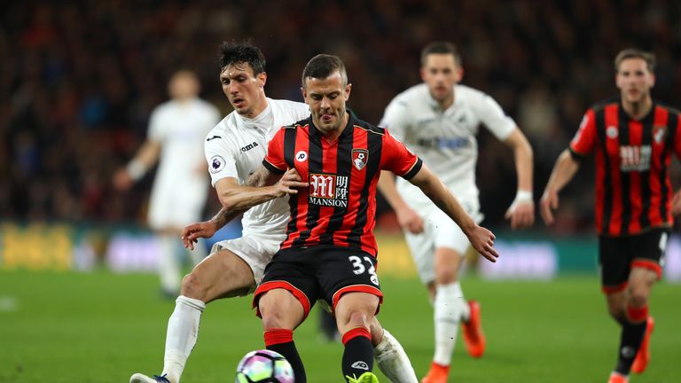 Jack Cork of Swansea City (left) and Bournemouth midfielder Jack Wilshere battle for possession