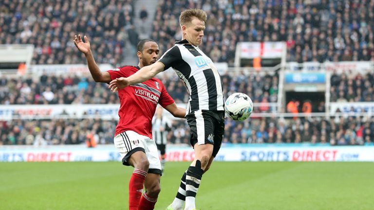 Matt Ritchie (right) and Fulham's Dennis Odoi tussle