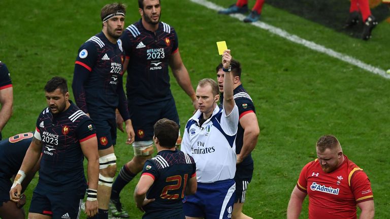 Wales' Samson Lee shown a yellow card