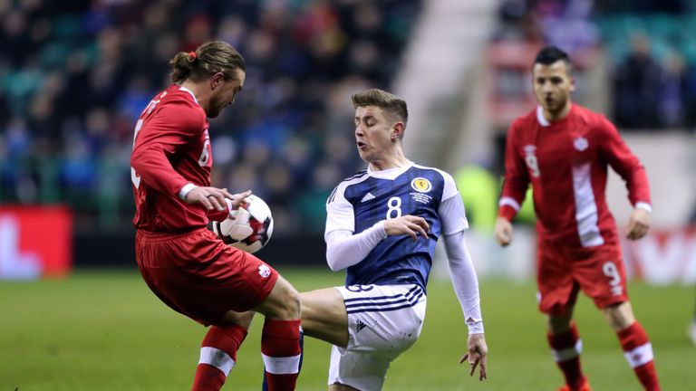 Tom Cairney (right) was handed his debut for Scotland on Wednesday