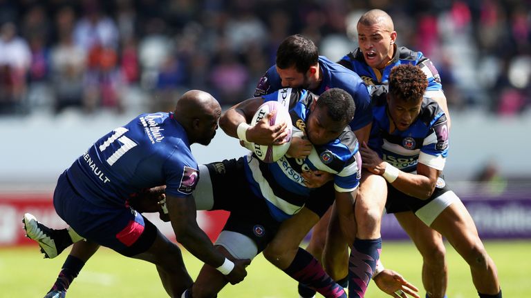 Semesa Rokoduguni is stopped in his tracks by Djibril Camara, Will Genia and Geoffrey Doumayrou