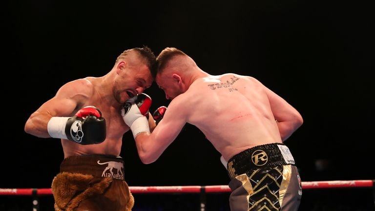 The pair stand chest to chest in the middle rounds