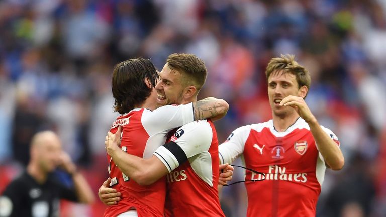 Aaron Ramsey hugs Hector Bellerin after his goal proved to be the winner