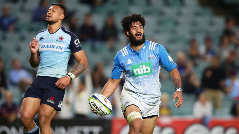 Akira Ioane of the Blues celebrates his try