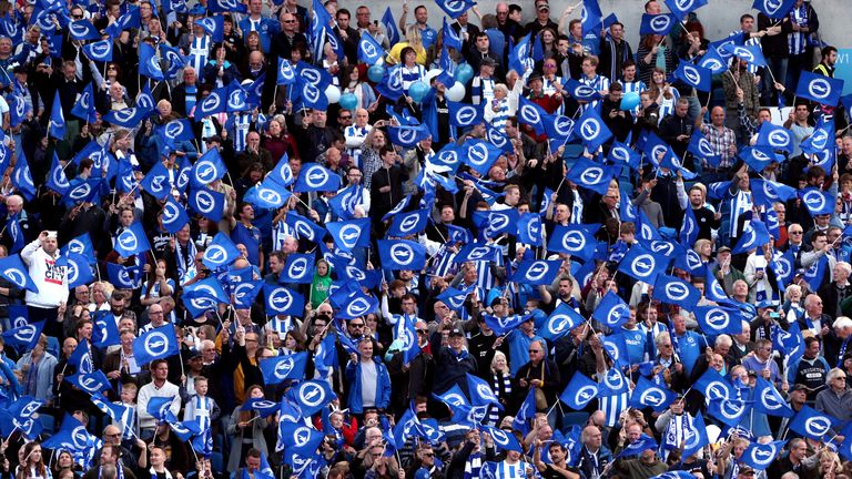 Brighton supporters have been commended by the club's chief executive Paul Barber for their response to homophobic chants from opposition fans