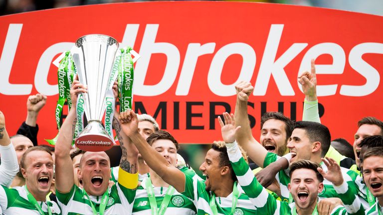 Celtic captain Scott Brown lifts the Ladbrokes Premiership trophy
