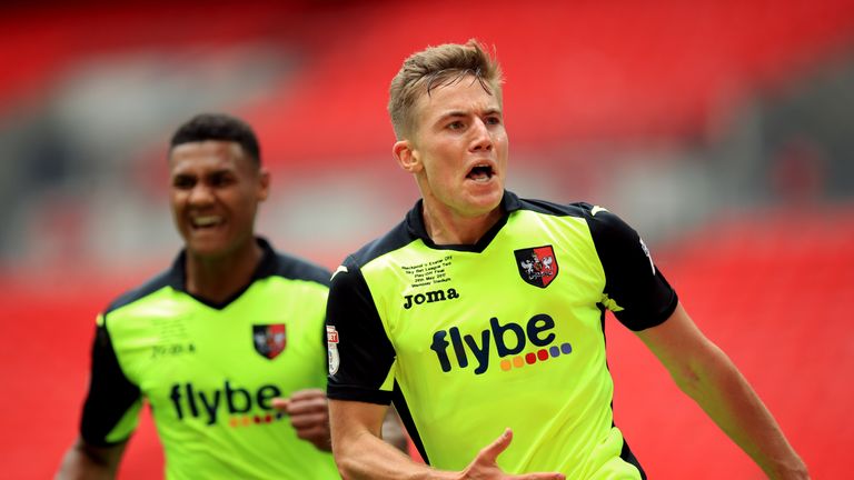 Exeter City's David Wheeler celebrates scoring his side's first goal of the game