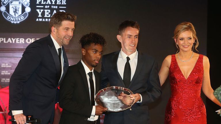 Angel Gomes is presented with the Jimmy Murphy award by U18s manager Kieran McKenna