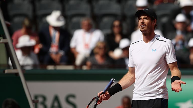 Murray protests with umpire Carlos Ramos after receiving a time penalty