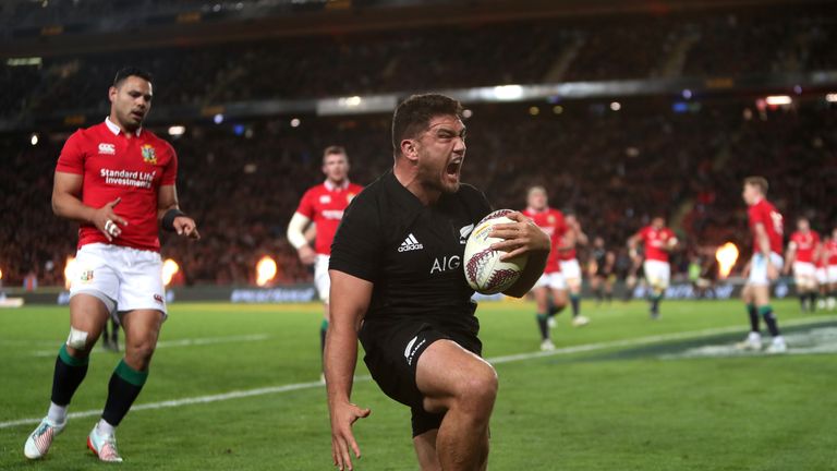Codie Taylor celebrates after scoring the game's first try