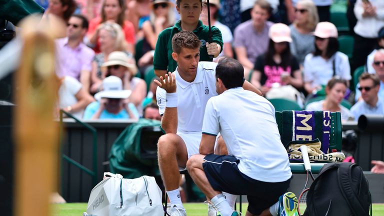 Martin Klizan retired from his men's singles first-round match against Novak Djokovic at Wimbledon
