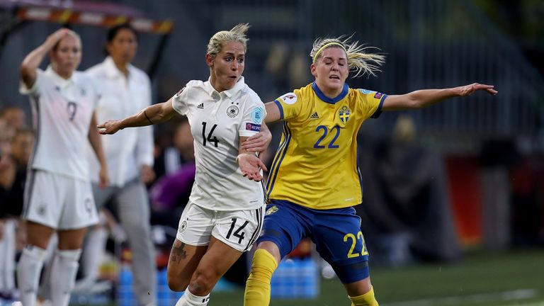 Anna Blaesse (left) of Germany battles for possession with Olivia Schough