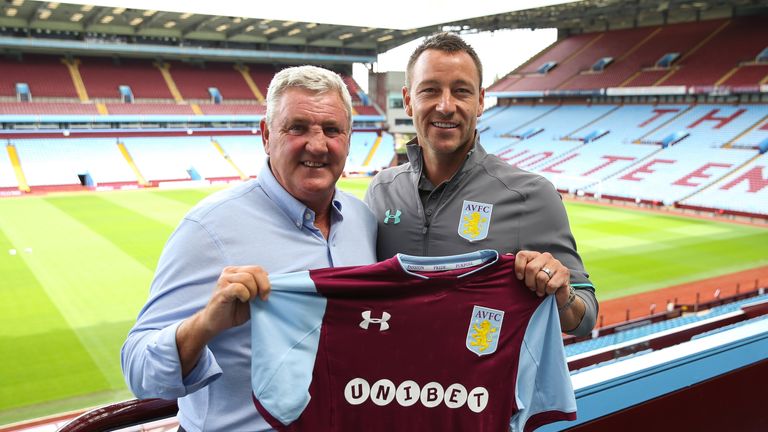 John Terry and manager Steve Bruce pose for a photo at Villa Park