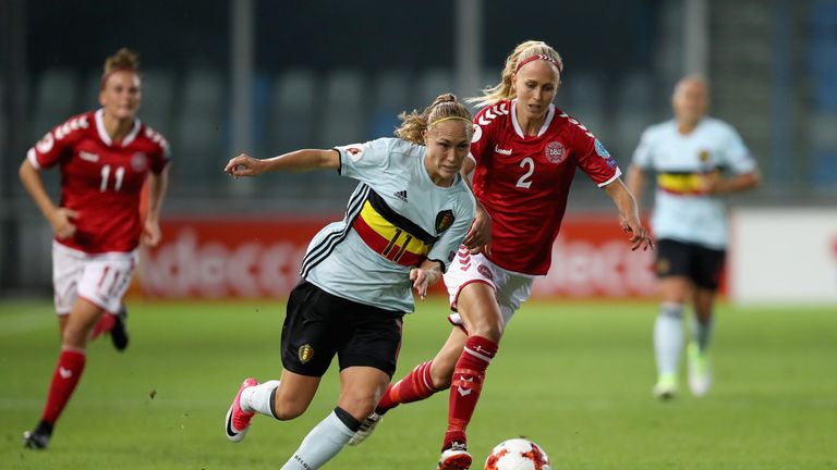 Janice Cayman of Belgium and Line Roddik Hansen of Denmark tussle during the match