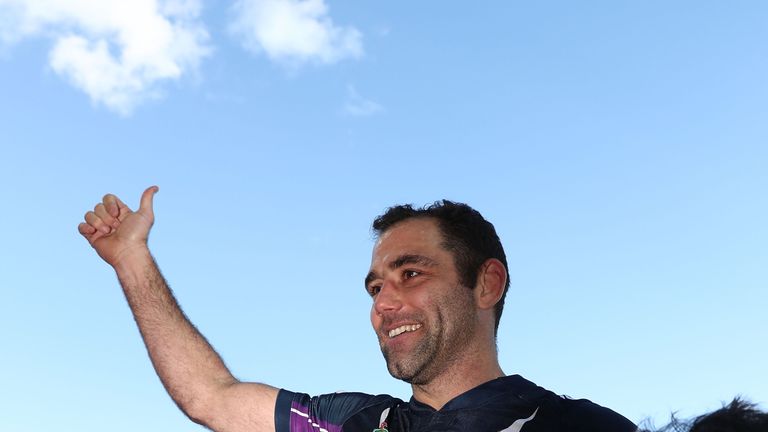 Cameron Smith is carried from the field by his teammates