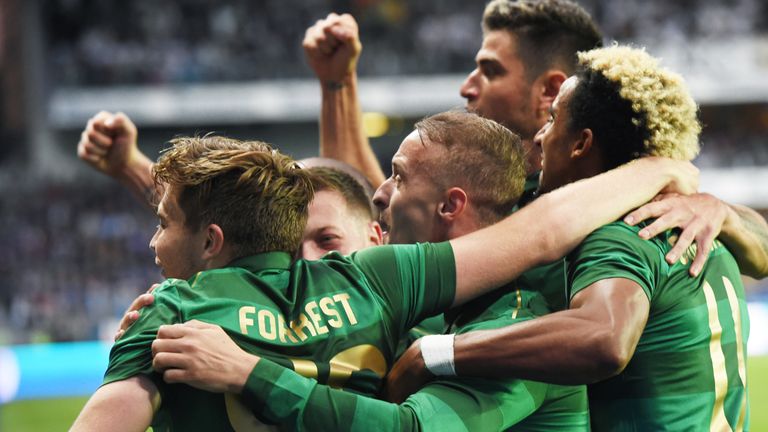 Celtic's players mob Forrest after his goal