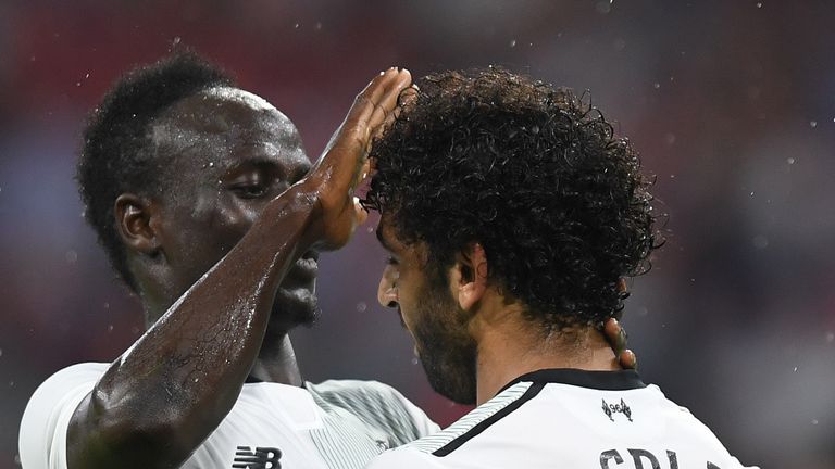 Mane (L) and Mohamed Salah (R) celebrate Liverpool's second goal