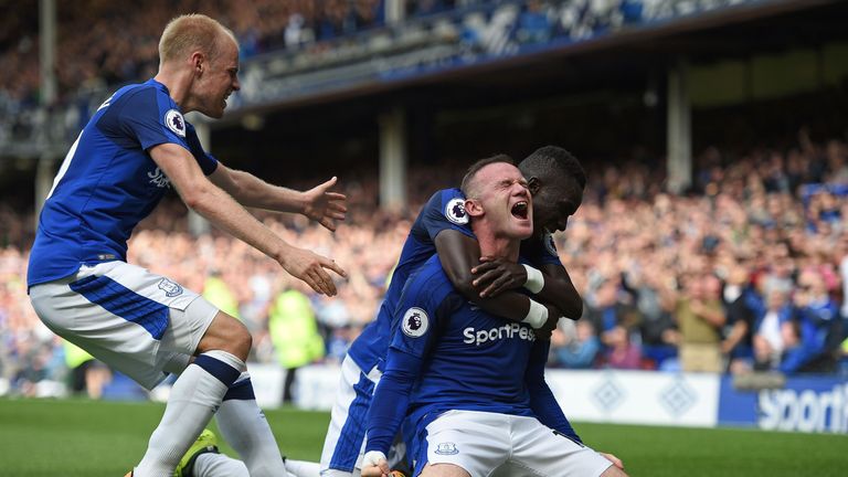 Rooney celebrates after scoring the winner on his Premier League return to Everton