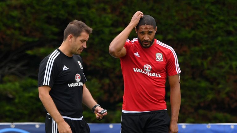 Owen in conversation with Wales captain Ashley Williams in training