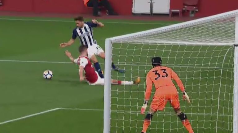 Jay Rodriguez goes down in the box under a challenge from Shkodran Mustafi