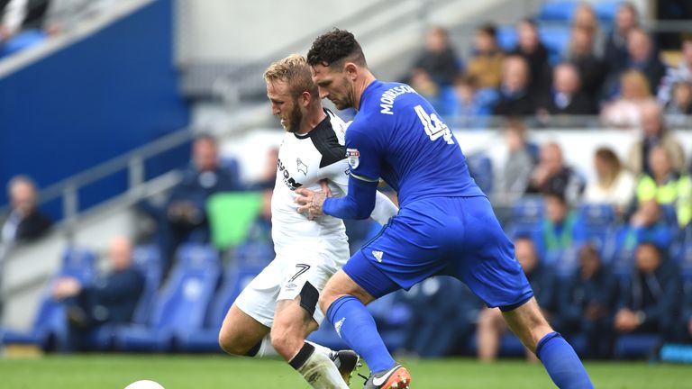 Sean Morrison (right) and Johnny Russell (left) battle for the ball