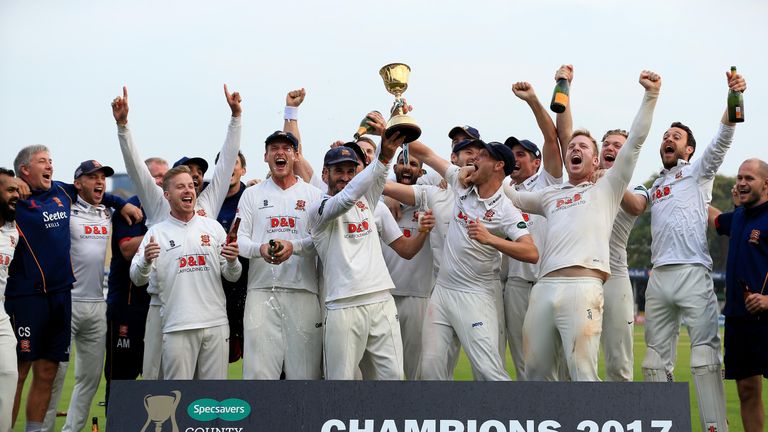 Essex's players lift the 2017 County Championship trophy