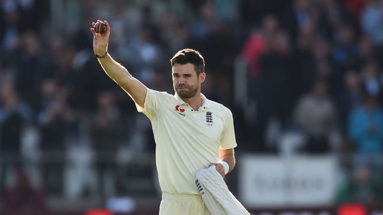 Anderson salutes the crowd after going through to the milestone