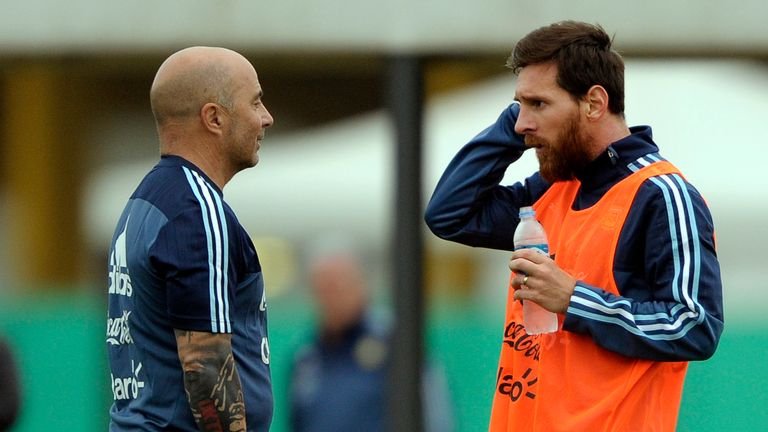 Messi (right) in discussion with his coach Jorge Sampaoli