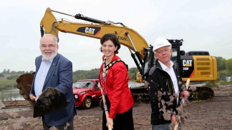Francie Molloy (MP for Mid Ulster), Councillor Kim Ashton (Chair of Mid Ulster District Council) and David Henderson (Manna Developments) dig the first parts of the track