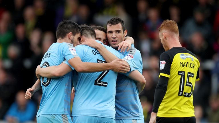 Bonatini celebrates with team-mates after putting Wolves 4-0 up away to Burton