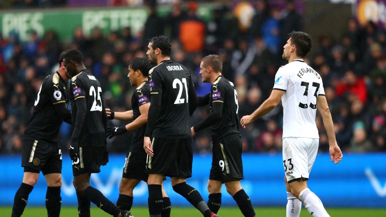 Swansea defender Federico Fernandez (right) shows his dejection after scoring an own goal against Leicester