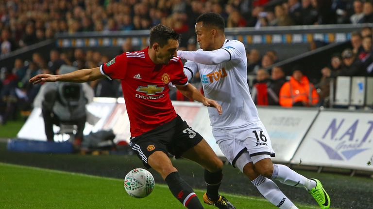 Matteo Darmian vies with Swansea defender Martin Olsson