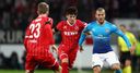 Arsenal clinch top spot despite defeat