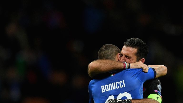 Leonardo Bonucci and Buffon console each other after Italy's exit